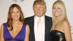 real-estate-tycoon-donald-trump-center-poses-with-model-heidi-klum-right-as-his-wife-melania-at-a-pa.webp