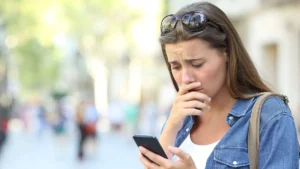 sad-girl-checking-phone-content-in-the-street-model-released-symbolfoto-publicationxinxgerxsuixautxo.webp