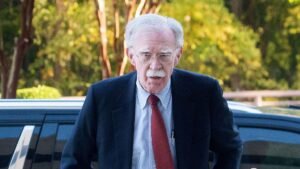 Former-Trump-administration-national-security-adviser-John-Bolton-left-arrives-for-his-arraignment-a.jpeg