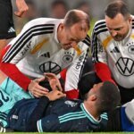 sorgenvolle-blicke-dfb-stuermer-deniz-undav-wird-auf-dem-spielfeld-behandelt.jpg