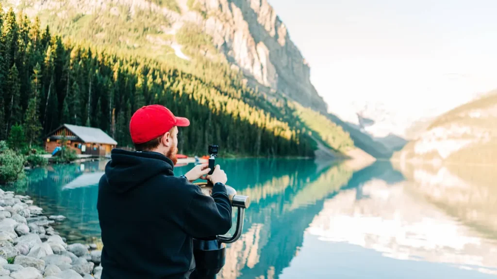 young-man-vlogging-at-lake-louise-in-banff-national-park-banff-alberta-canada-cr-xpqf250623c-1735337.webp