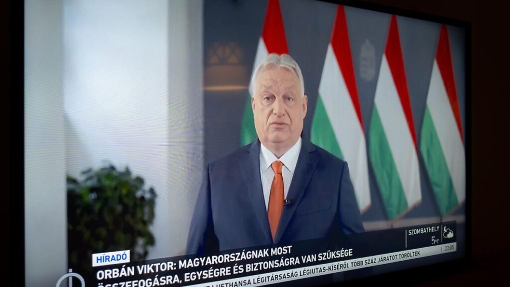 A-television-set-in-a-hotel-room-shows-Hungarian-Prime-Minister-Viktor-Orban-during-a-televised-appe.jpeg