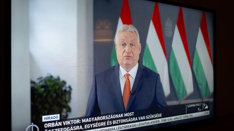 A-television-set-in-a-hotel-room-shows-Hungarian-Prime-Minister-Viktor-Orban-during-a-televised-appe.jpeg