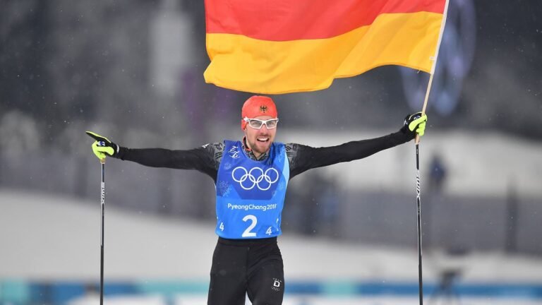 Schlusslaeufer-Johannes-RYDZEK-GER-laeuft-mit-der-Deutschland-Fahne-Flagge-ins-Ziel-Jubel-Freude-Beg.jpeg
