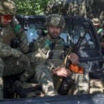Servicemen-of-the-425th-Separate-Assault-Regiment-of-the-Ukrainian-Armed-Forces-sit-in-a-pickup-truc.jpeg