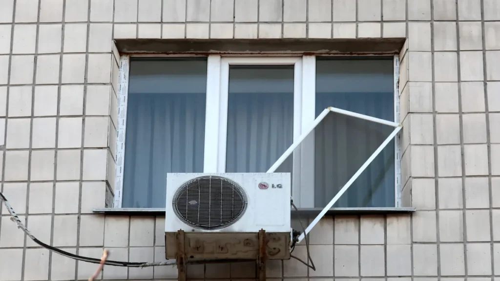 aftermath-of-russian-drone-attack-in-kyiv-a-window-with-an-ac-is-in-a-residential-building-in-the-sv.webp