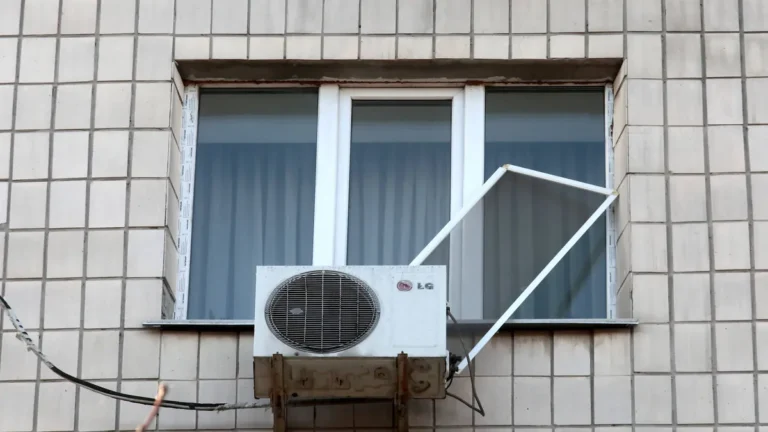 aftermath-of-russian-drone-attack-in-kyiv-a-window-with-an-ac-is-in-a-residential-building-in-the-sv.webp