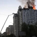 firefighters-work-at-the-site-of-an-apartment-building-damaged-during-overnight-russian-missile-and.webp