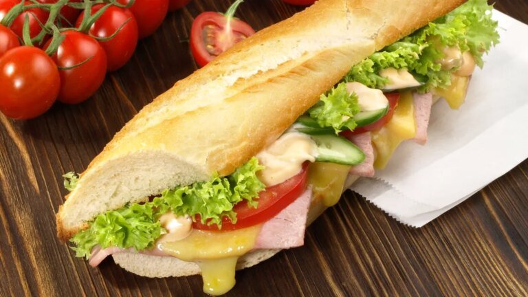 french-baguette-with-ham-and-cheese-french-baguette-with-ham-and-cheese-on-wooden-background.jpg